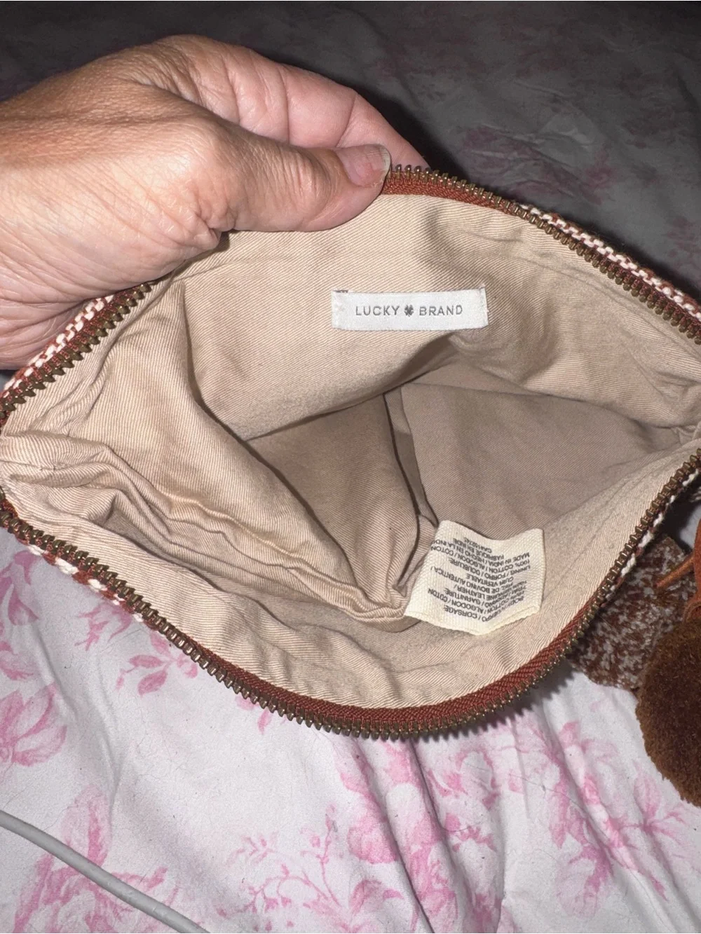 Never worn…Women's Lucky Brand  Brown Patterned Knit Clutch with Pom Tassel